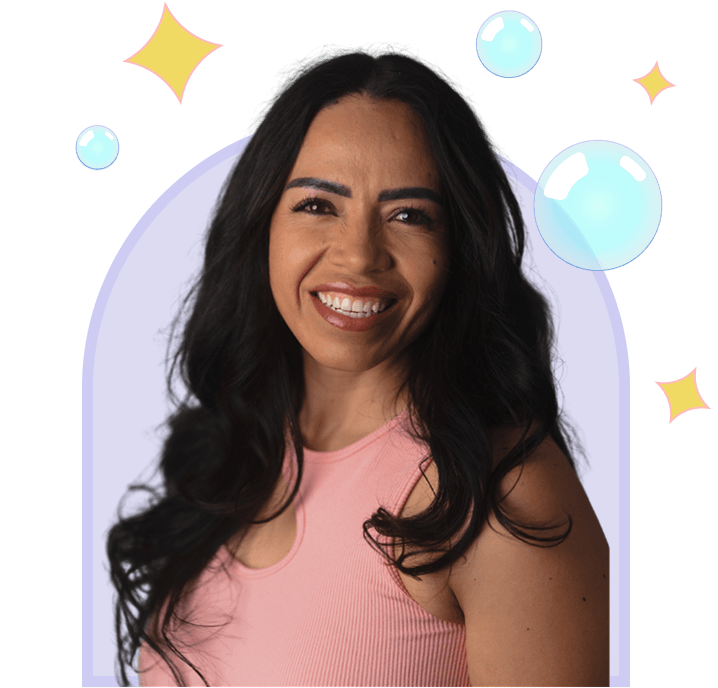 A smiling woman with long dark hair and a pink top, framed by a soft purple arch, surrounded by decorative bubbles and stars.